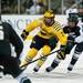Michigan sophomore left wingman Phil Di Giuseppe skates with the puck in the third period of the game against Michigan State on Friday. Daniel Brenner I AnnArbor.com